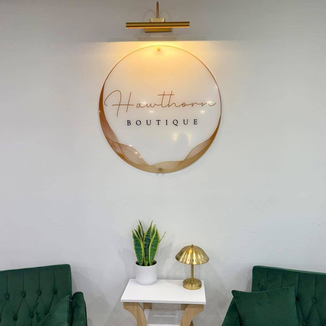 boutique logo sign on wall in shop acrylic custom made