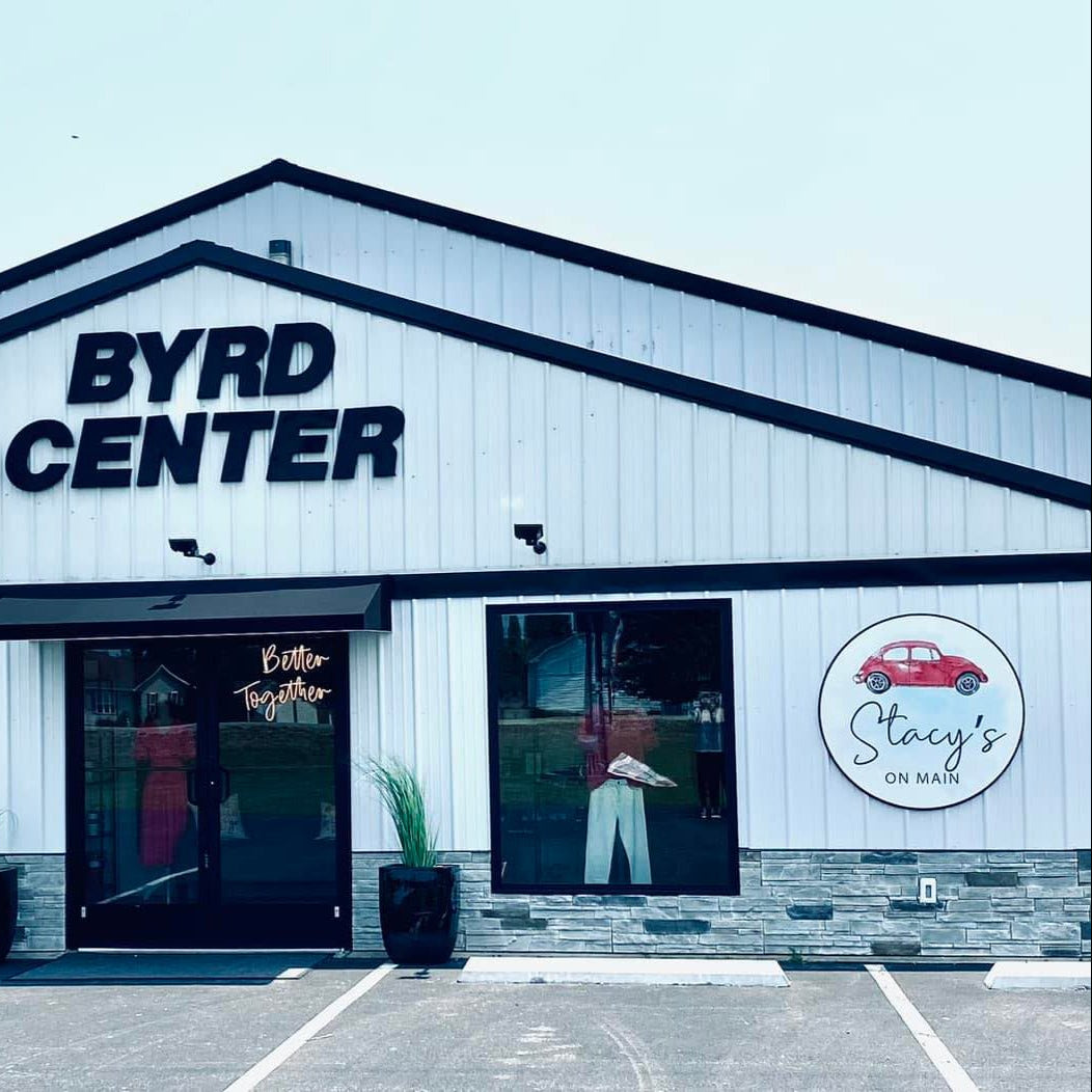 storefront with printed outdoor logo sign and acrylic letters business name mounted to building durable weather resistant signage