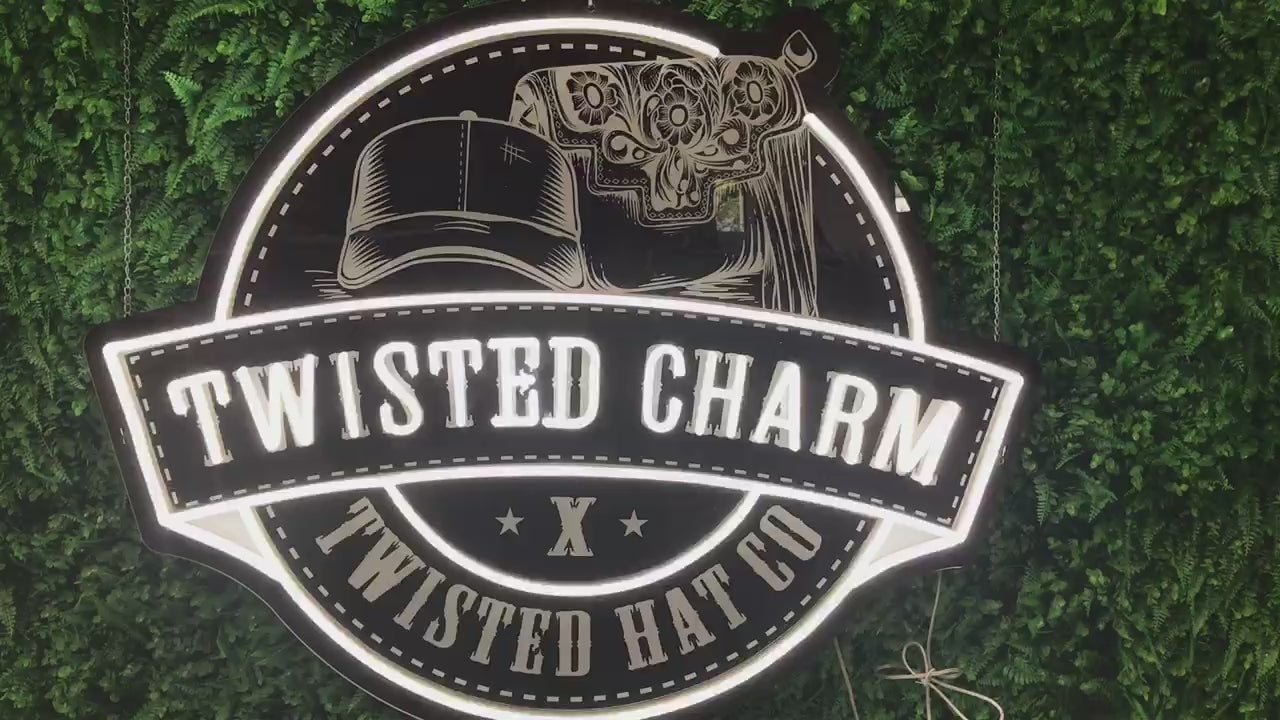 video of custom LED lighted neon sign with printed background Twisted Charm boutique