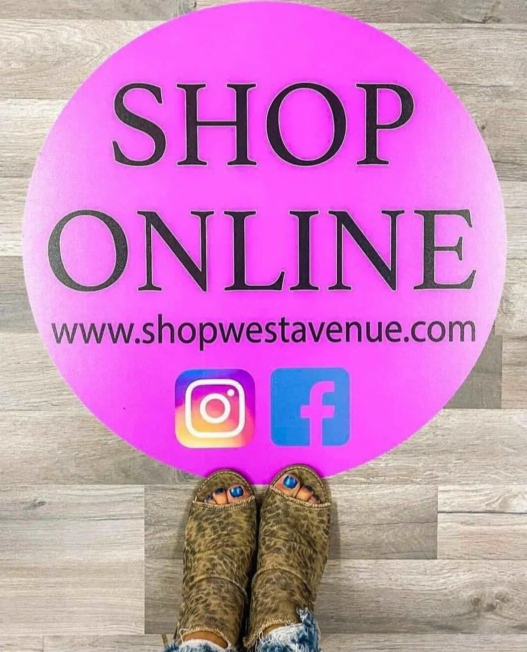 Custom floor decal in boutique shop pink with social media and website facebook Instagram