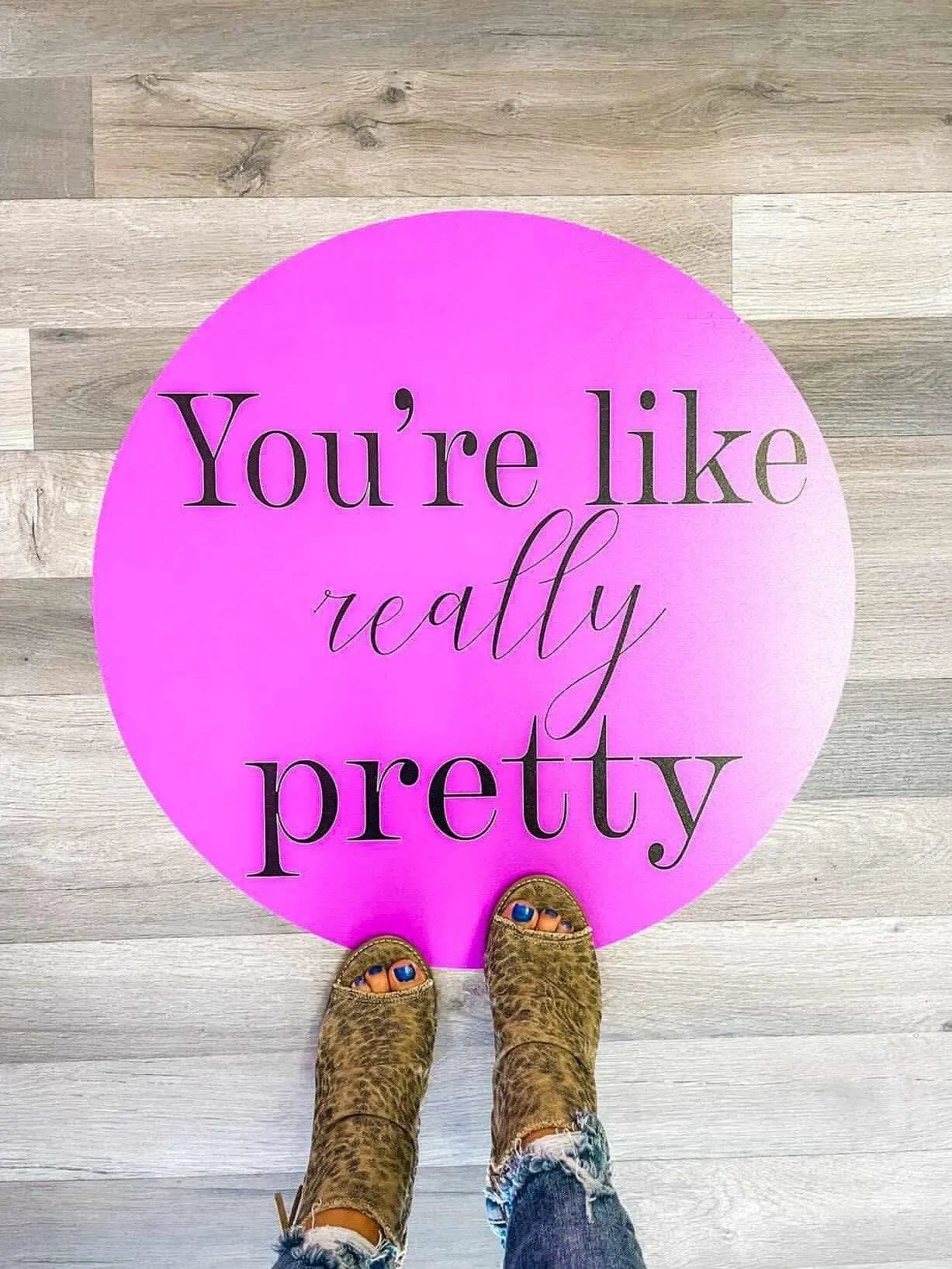 Custom floor decal in boutique shop pink you're like really pretty
