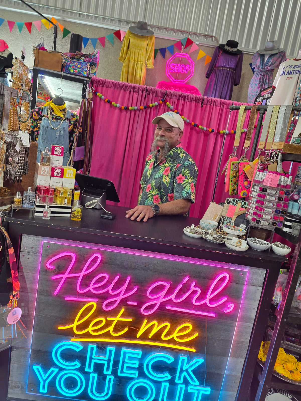 Colorful Check Out Process Sign Man behind a counter with a custom LED lighted neon checkout sign in a ...