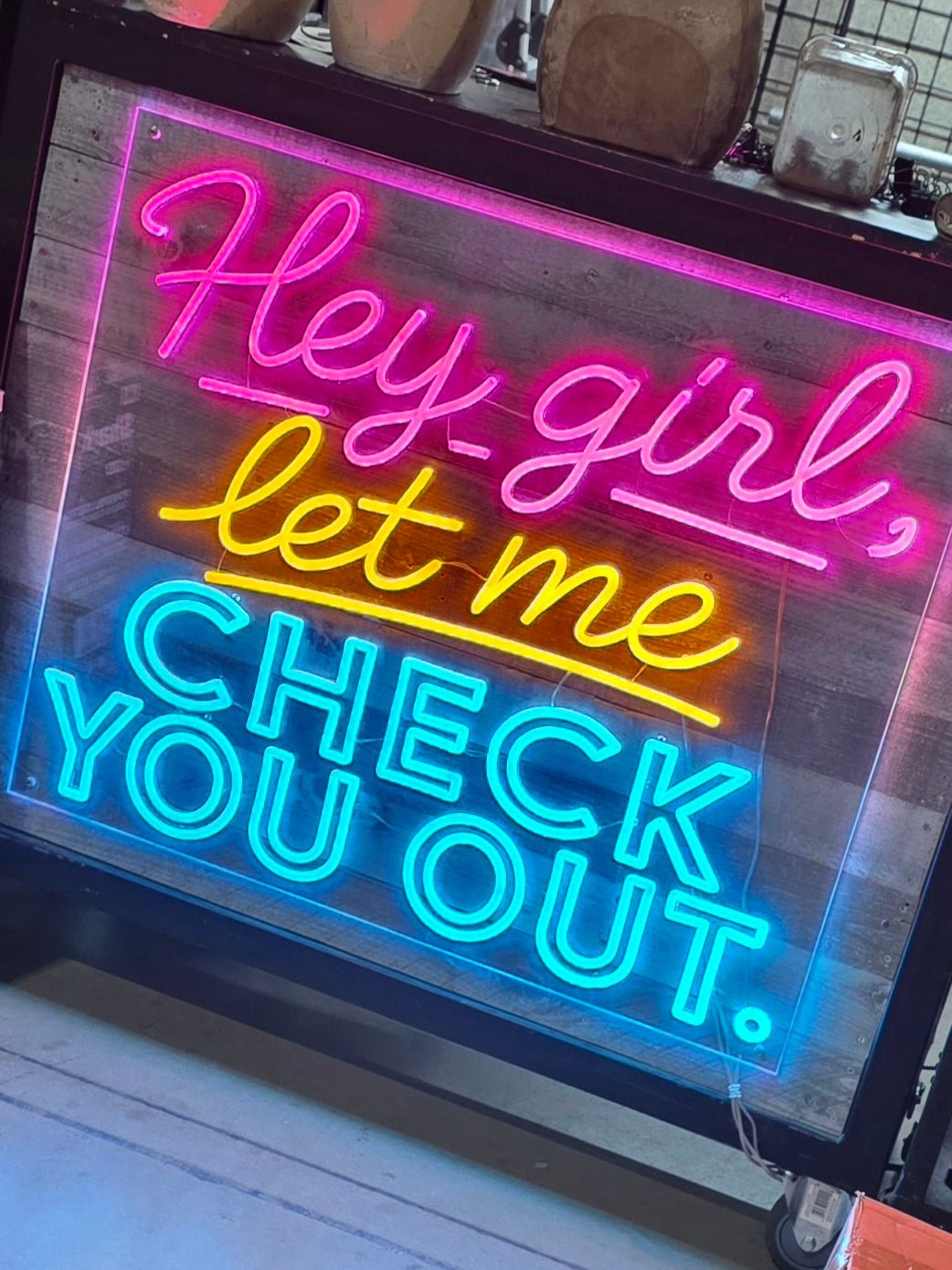 custom lighted sign LED neon for boutique checkout counter that says Hey Girl Let Me Check You Out