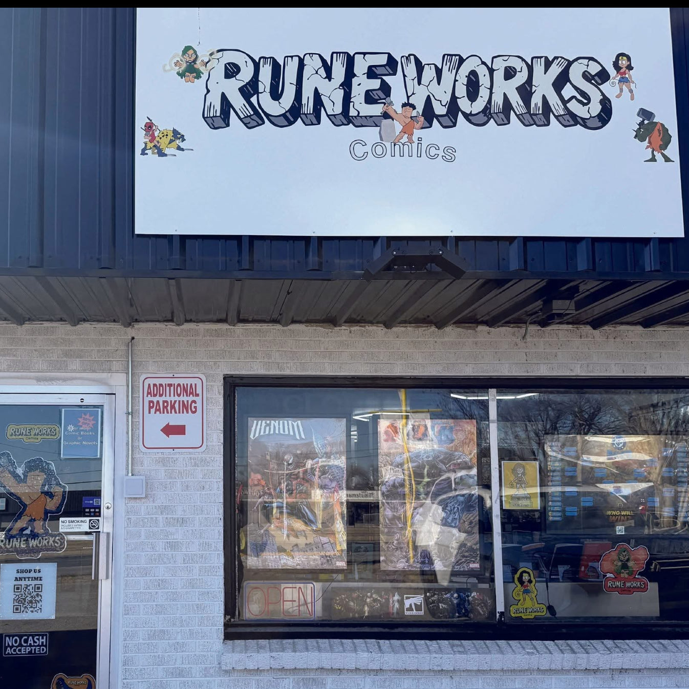 large outdoor storefront business sign with logo