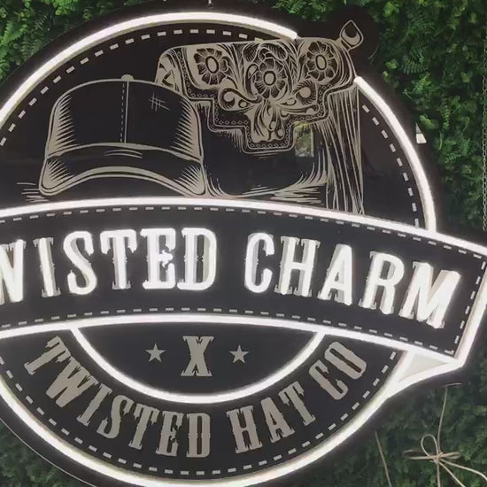 video of custom LED lighted neon sign with printed background Twisted Charm boutique